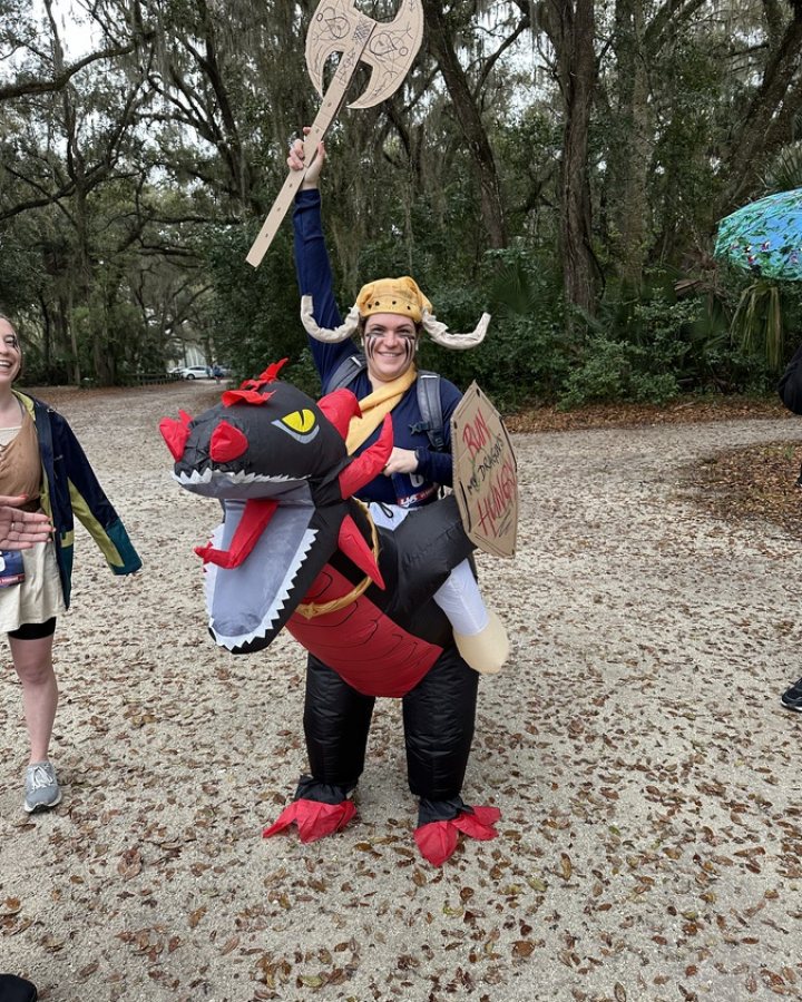 US Road Running race day photo with runners, walkers, finisher medals, and race staff