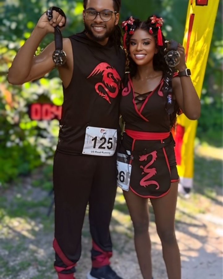 US Road Running race day photo with runners, walkers, finisher medals, and race staff
