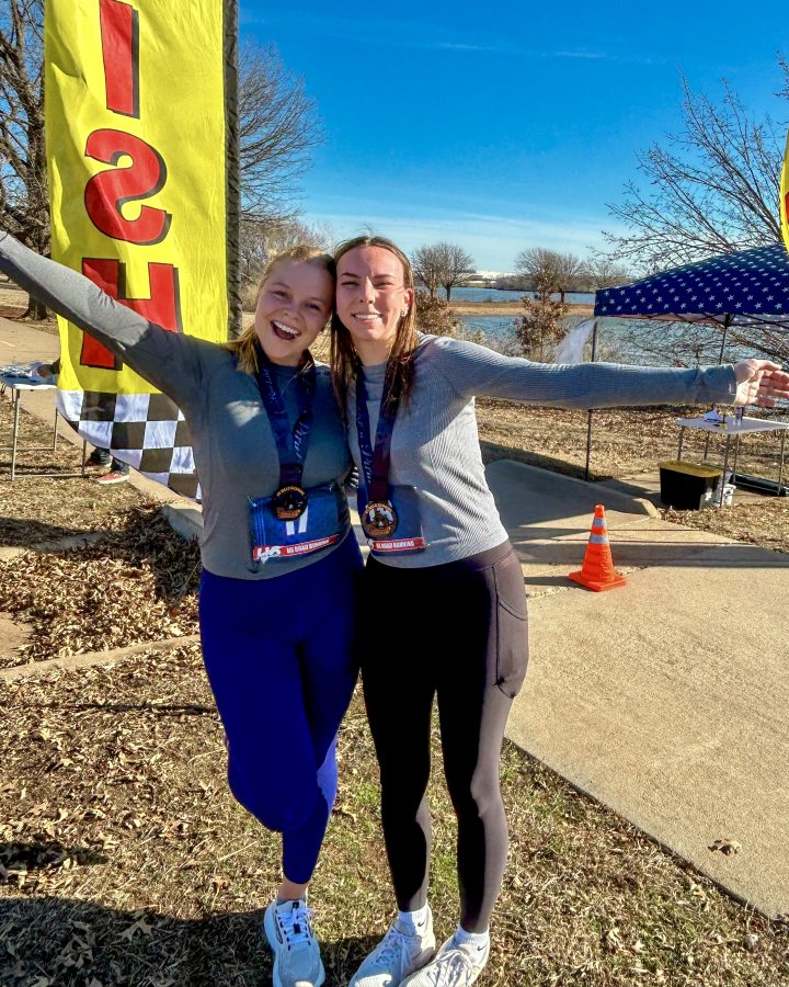 US Road Running race day photo with runners, walkers, finisher medals, and race staff