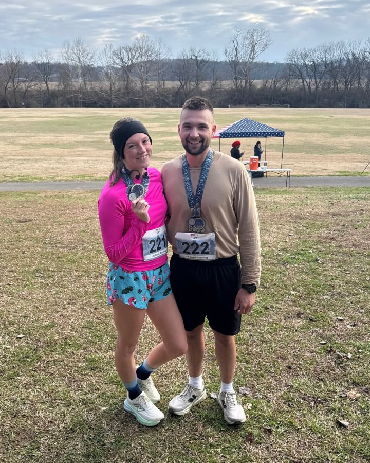 US Road Running race day photo with runners, walkers, finisher medals, and race staff