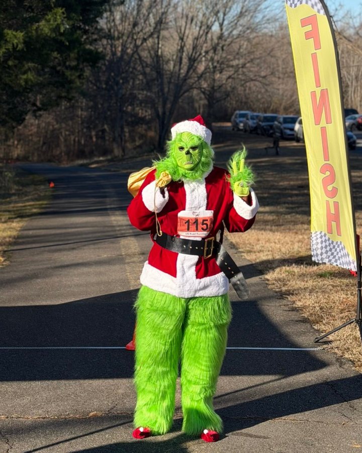 US Road Running race day photo with runners, walkers, finisher medals, and race staff