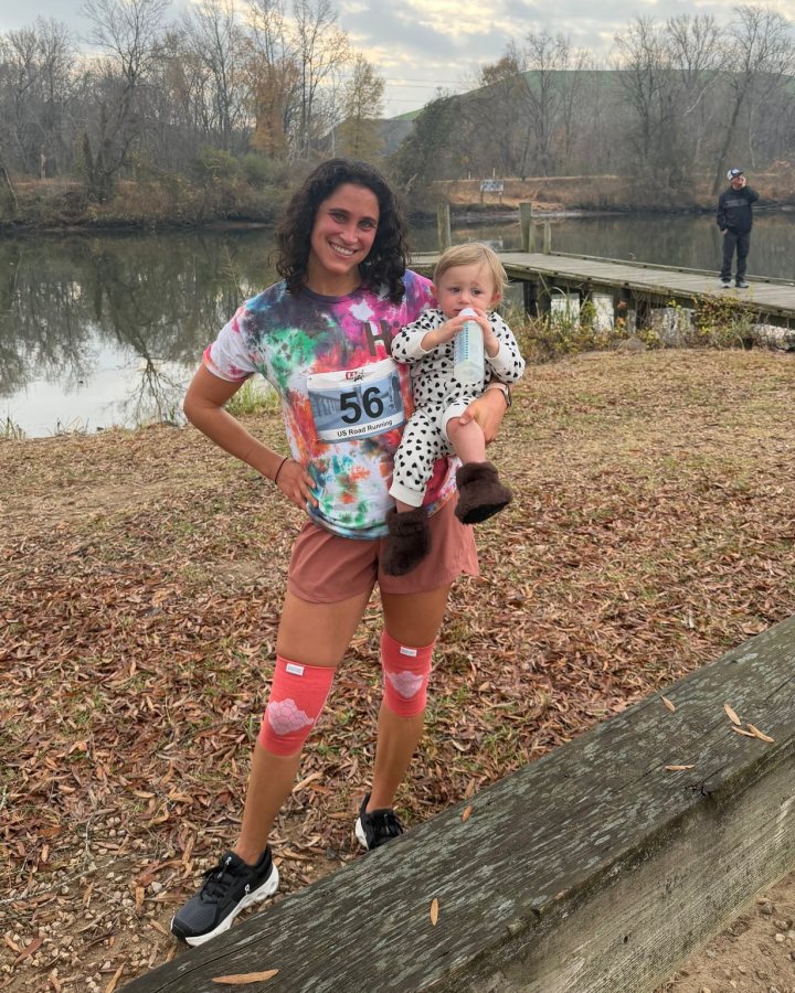 US Road Running race day photo with runners, walkers, finisher medals, and race staff
