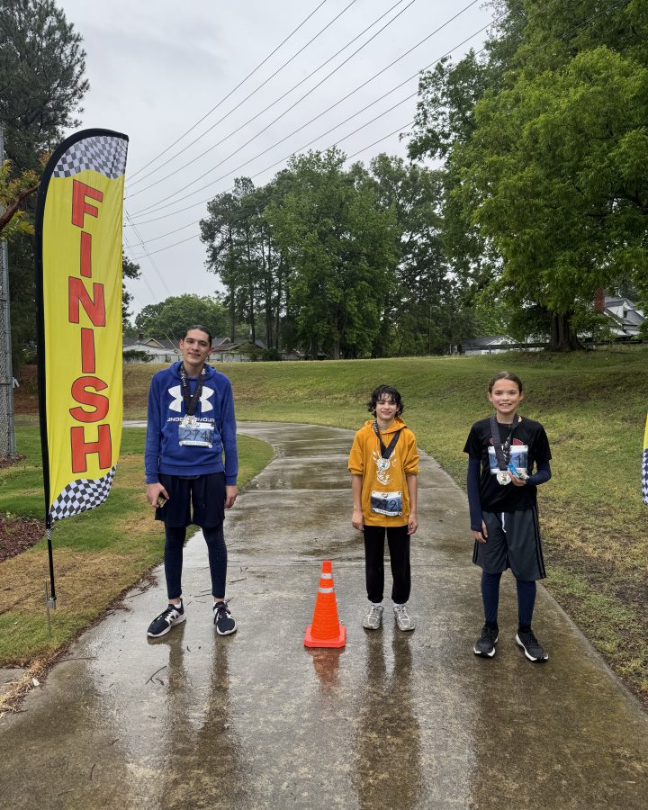 Morgan Ampong at Luau 5K, 10K, & 13.1M at Rocky Mount, NC (18) - 05/02/2026 after earning 1st MALE Overall