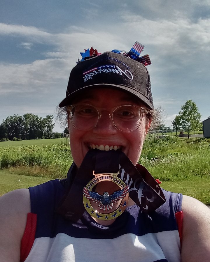 Jennifer McDaniels at Eagle 5K, 10K, & 13.1M at Grand Ledge, MI (27) - 07/04/2026 after earning Best Costume